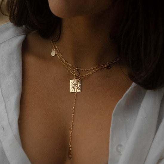 The Ananda pendant is 15.3mm x 20.3mm. Chain length: 50cm Features adjustable hoops to shorten chain. Beautifully handcrafted in 2 micron 18k Gold on solid 925 Sterling Silver.